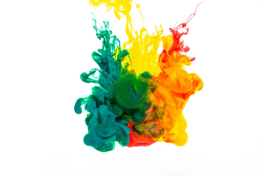 mix of paint colors in water on a white background